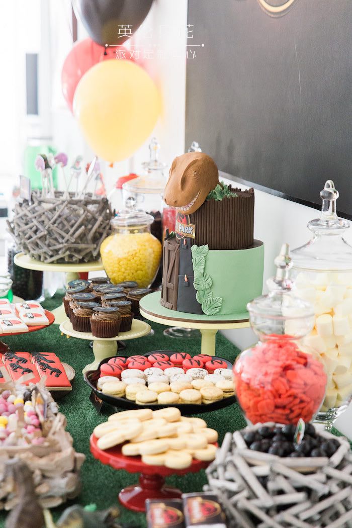 Side-view of the Sweet Table from a Jurassic Park Dinosaur Birthday Party via Kara