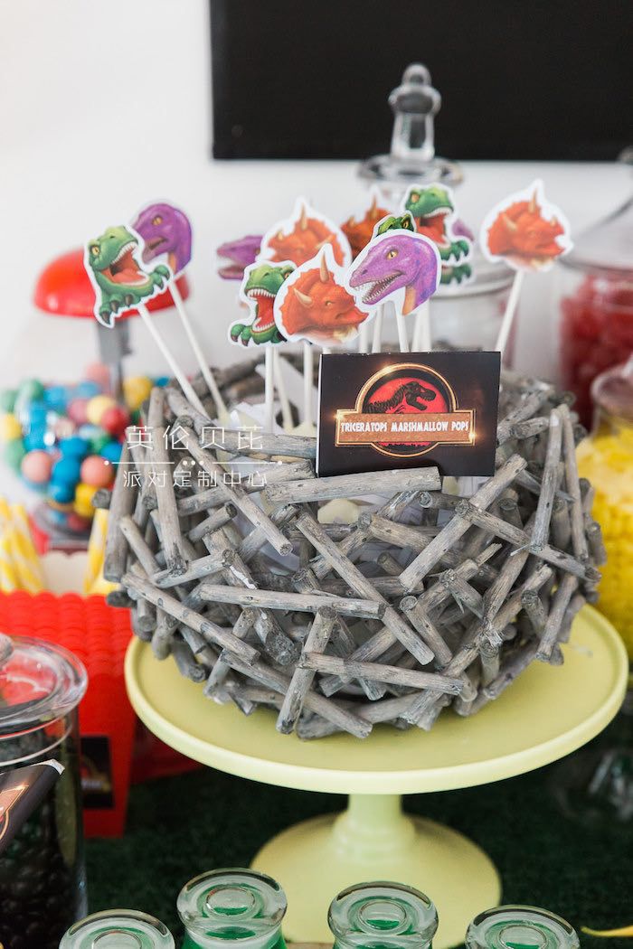 Marshmallow Pops placed in a Dinosaur Nest from a Jurassic Park Dinosaur Birthday Party via Kara